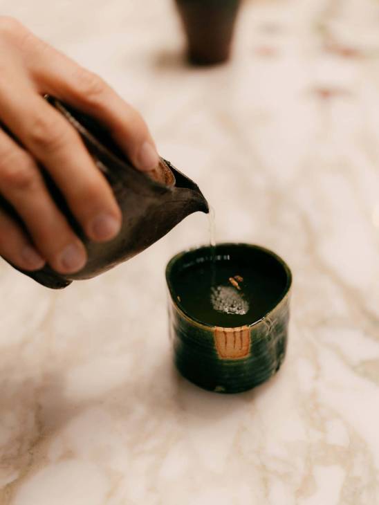 A ceramic saucer and pot.