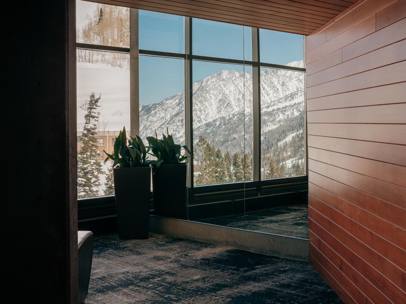 Floor-to-ceiling windows offer spectacular snowy views
