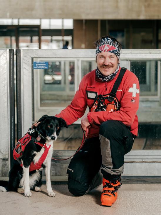 Ski patroller Sam Chovan with avalanche dog Mabel