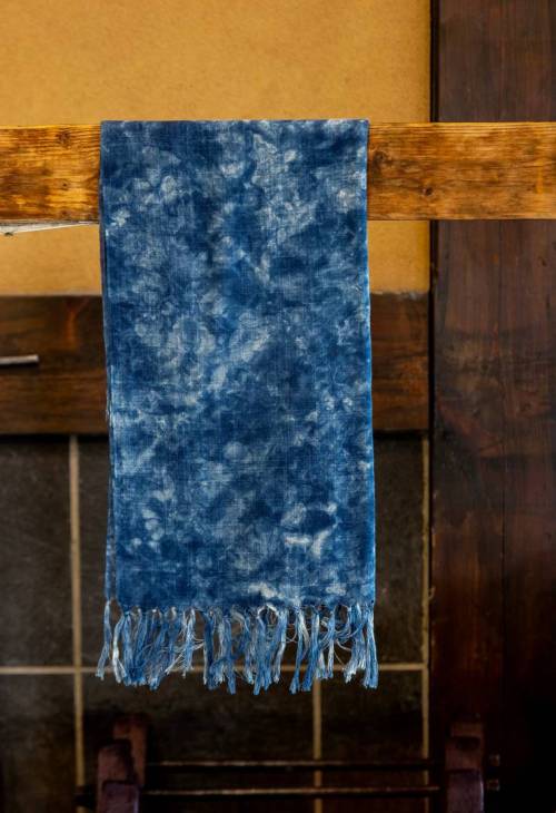 A dyed blanket drying.
