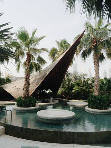 An outdoor swimming pool and lounge at Siro One Za’abeel.