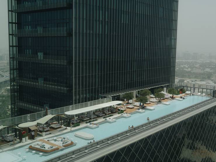 An outdoor swimming pool and lounge at Siro One Za’abeel.