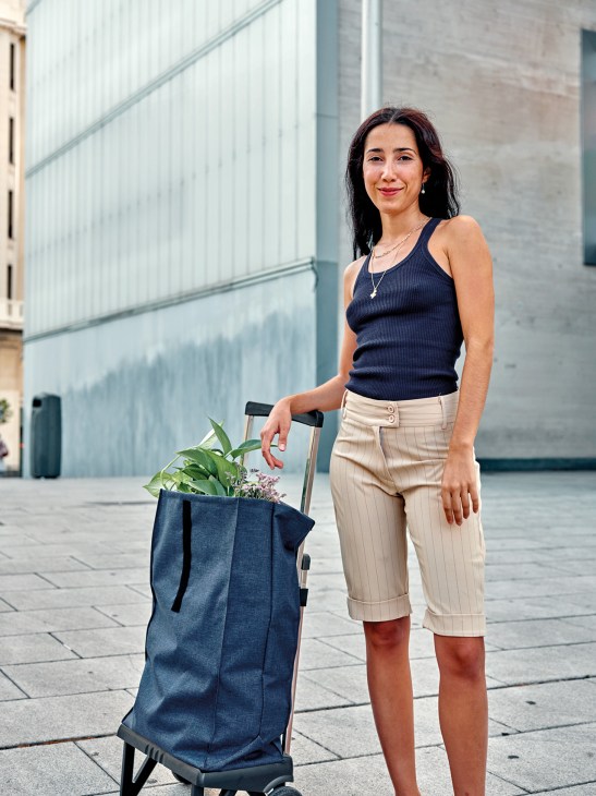 A woman with a Rolser shopping trolley