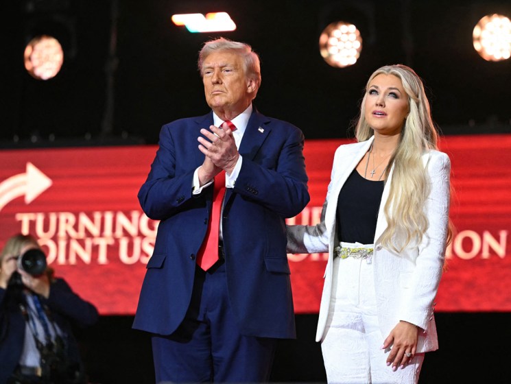 US President Donald Trump reacts next to Erika Kirk, widow of Charlie Kirk, after speaking at the public memorial service for right-wing activist Charlie Kirk at State Farm Stadium in Glendale, Arizona, on September 21, 2025. (Photo by Mandel NGAN / AFP) (Photo by MANDEL NGAN/AFP via Getty Images)