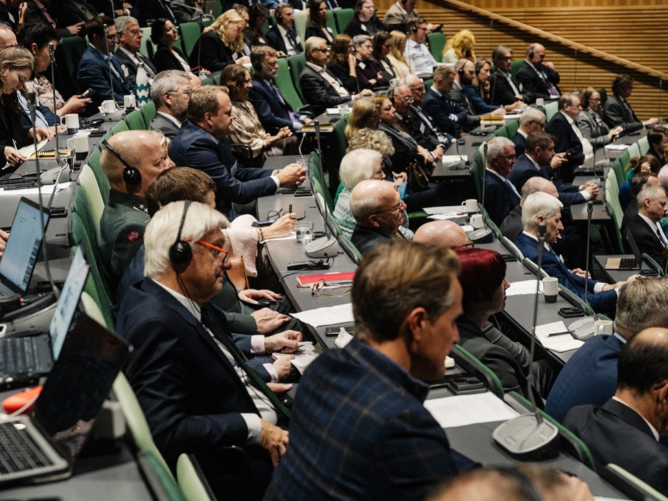 Delegates listen to a talk in the main auditorium