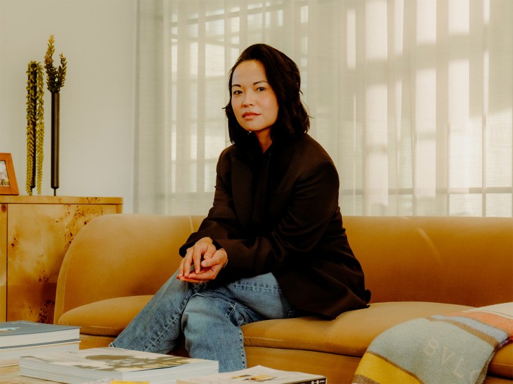 Portrait of Erina Pindar sitting on a couch