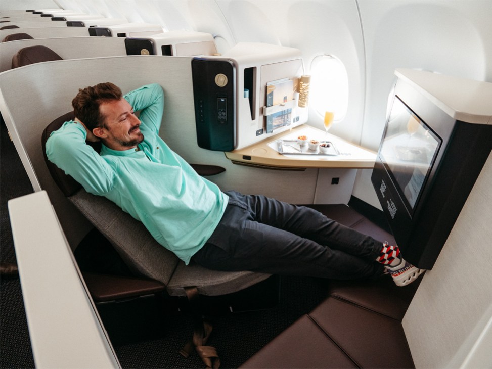 Review of the Etihad A321LR - passenger relaxing in business class seat