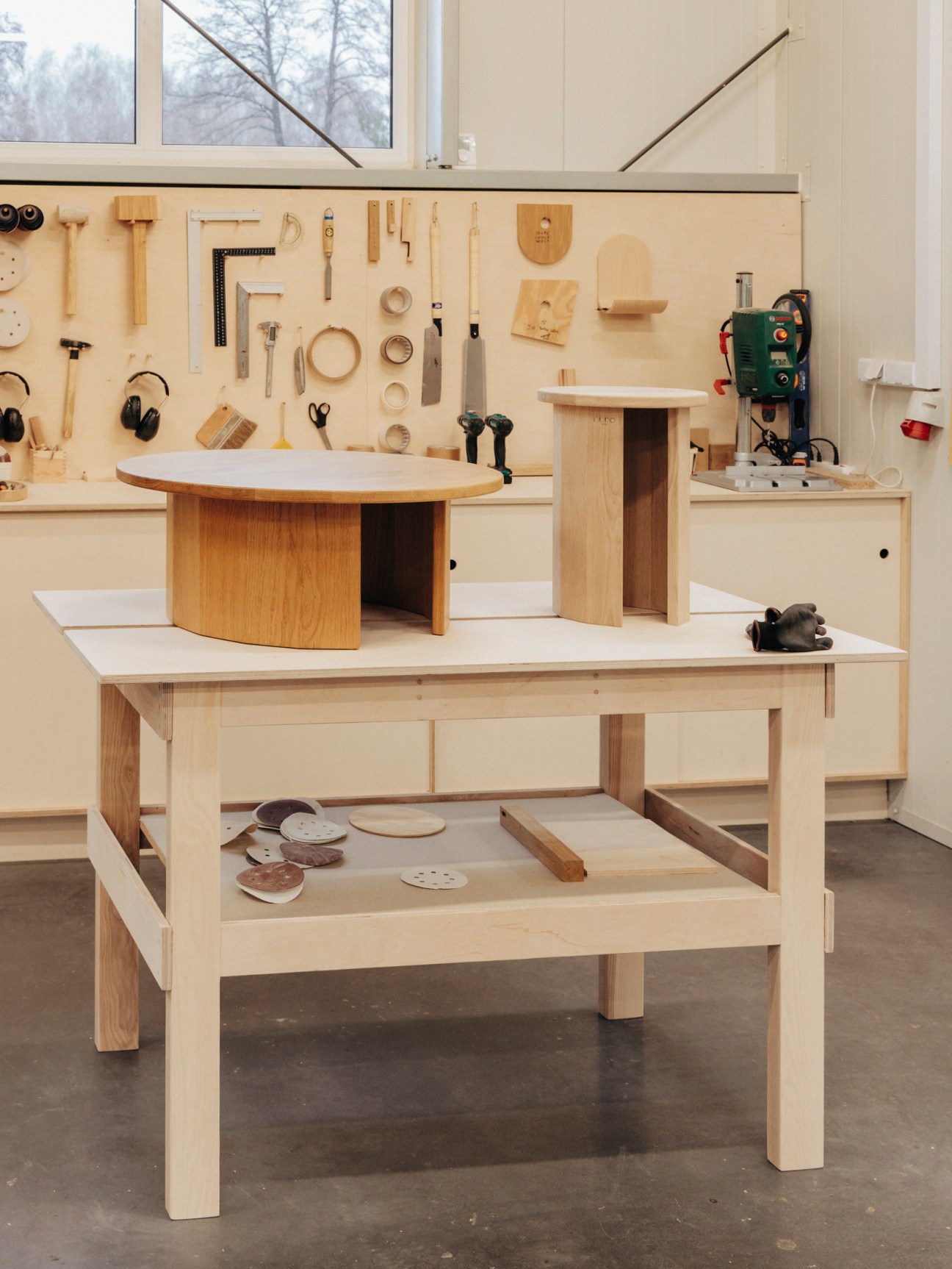Furniture pieces awaiting finishing at Nudo workshop
