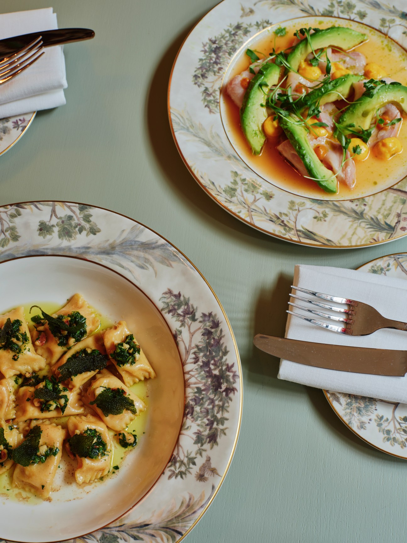 Agnolotti with hazelnut gremolata, and hamachi crudo with avocado