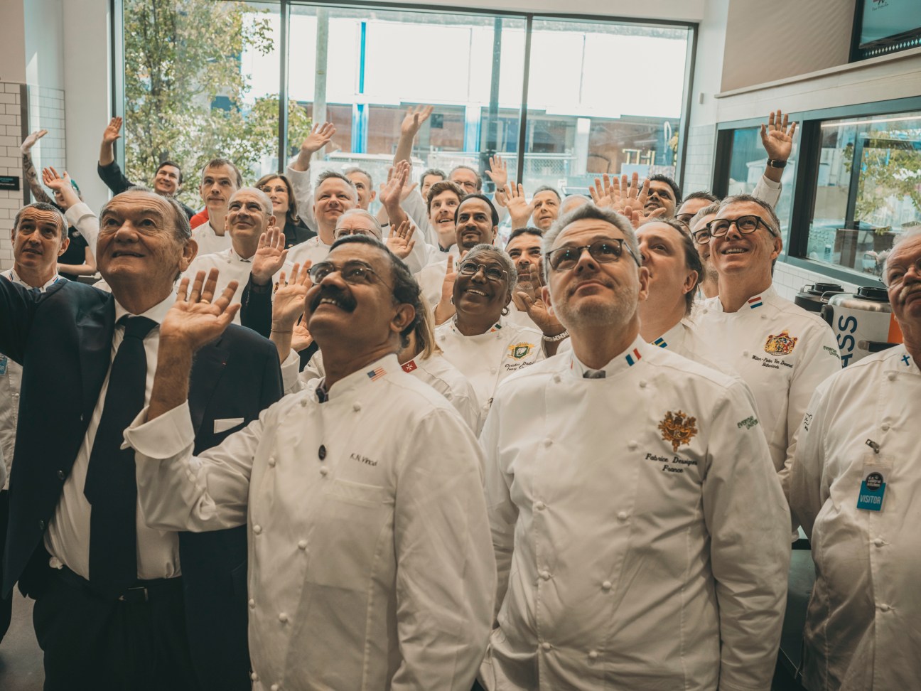 Group of chefs from around the world posing together at the Washington summit