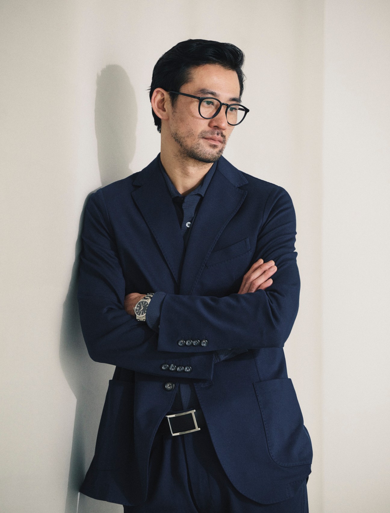 Jacket and trousers by Circolo 1901, shirt by Glanshirt, glasses by Mykita, sbgh301 watch by Grand Seiko, belt by JM Weston