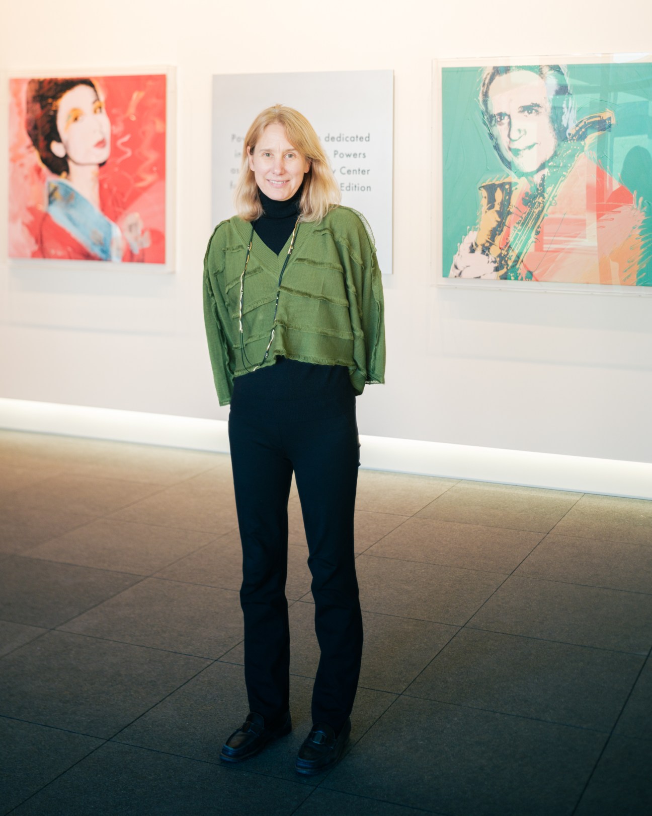 woman posing for a photo in a gallery