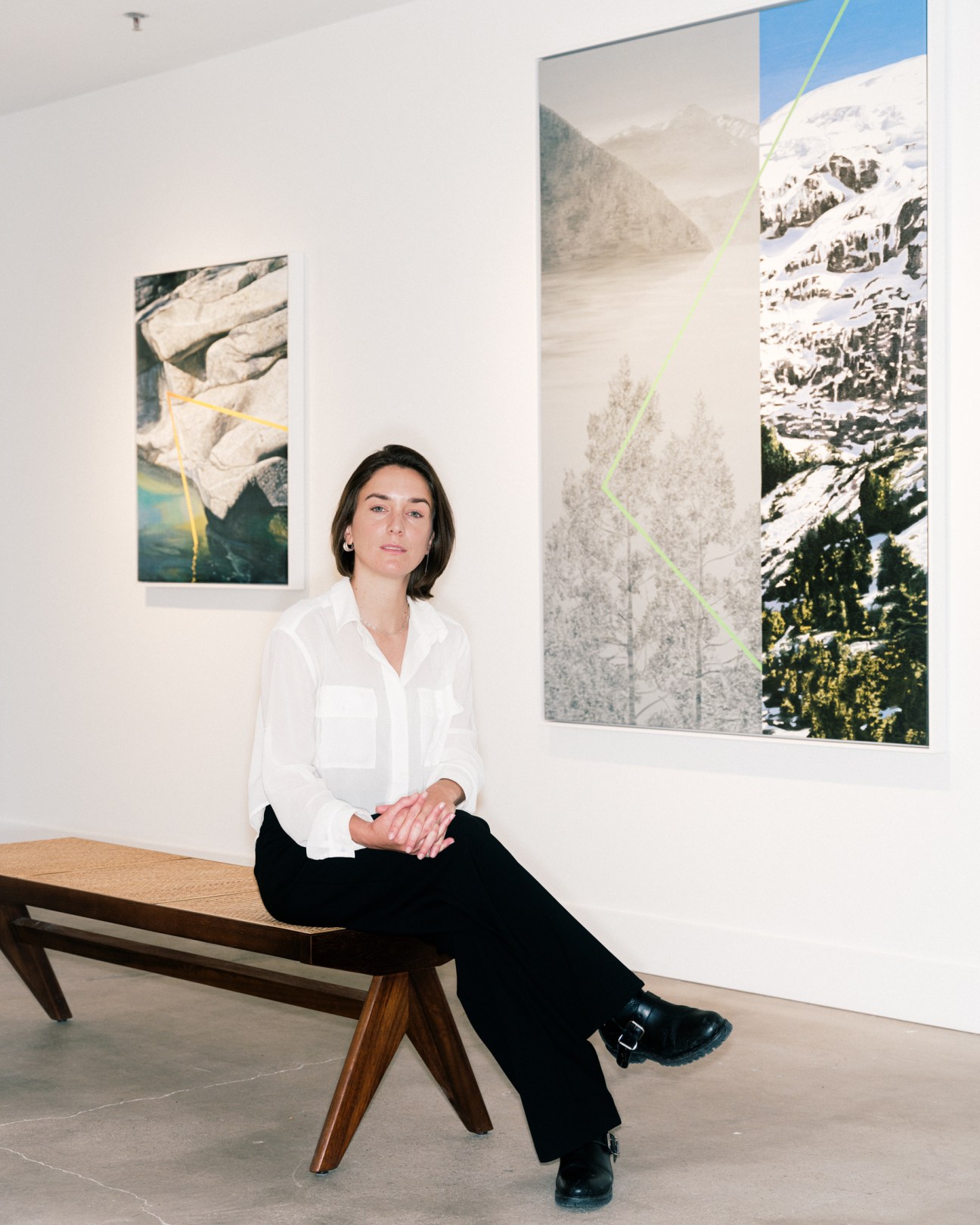 woman sitting on a gallery bench