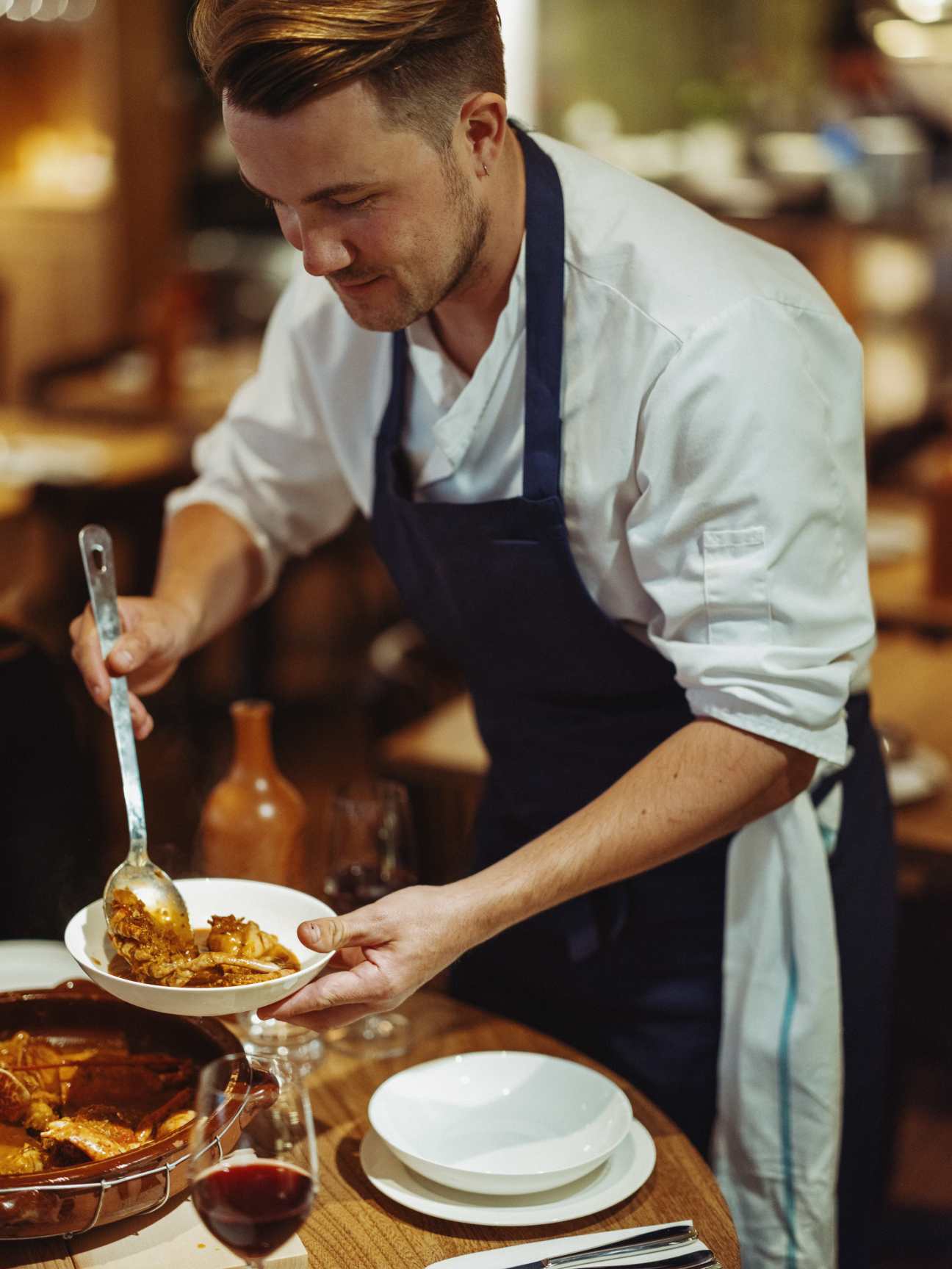 Chef serving food at a restaurant