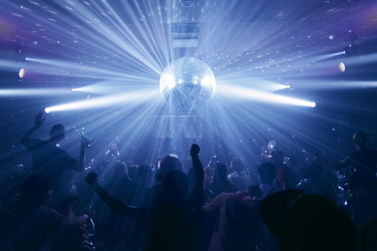 Club-goers dancing at Klymax Discotheque