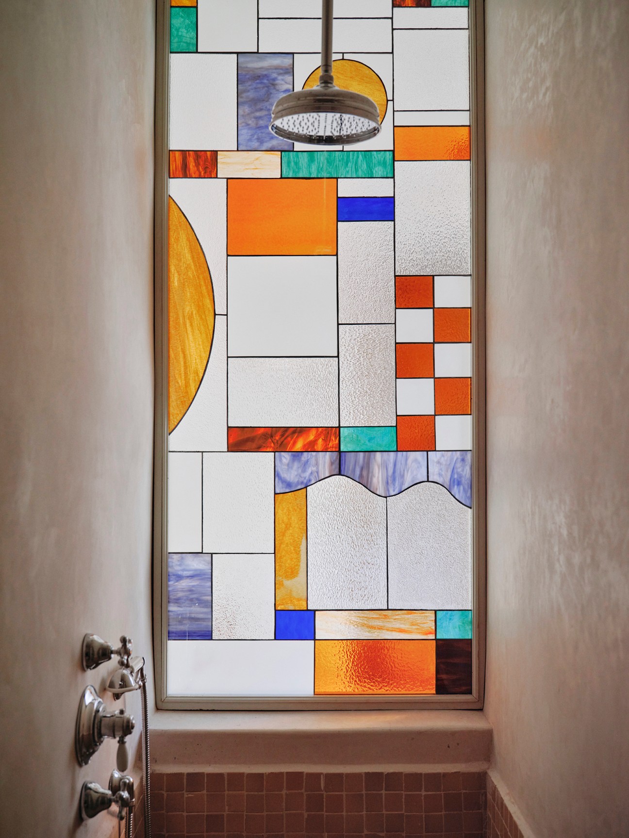 Stained glass window in one of the bathrooms
