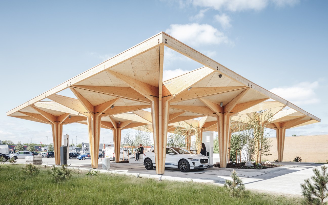 Close-up view of wooden canopy design at an electric vehicle charging station