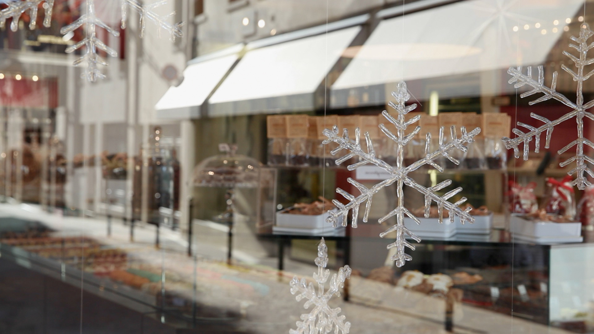 Glass snow flakes in a shop window.