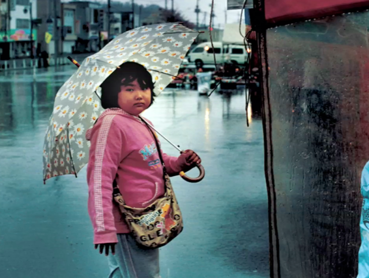 child with umbrella