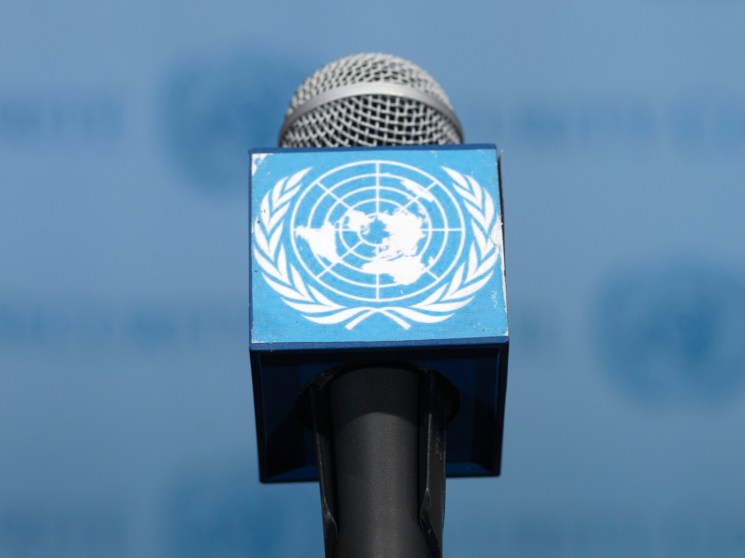 A microphone with a logo of the United Nations.